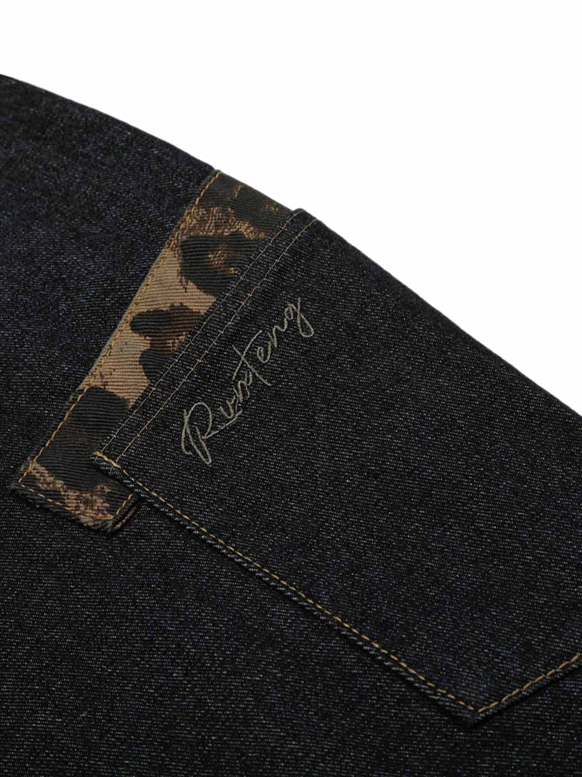 Jean patchwork en denim délavé à imprimé guépard