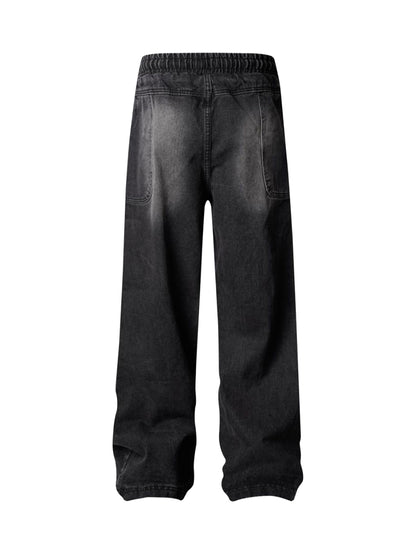 Verwaschene Distressed-Jeans im dekonstruierten Split-Cordstring-Stil