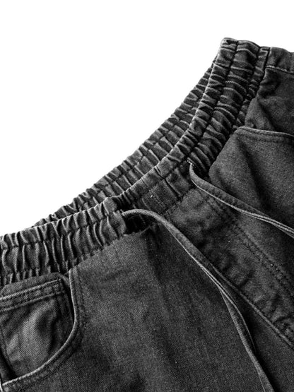 Verwaschene Distressed-Jeans im dekonstruierten Split-Cordstring-Stil