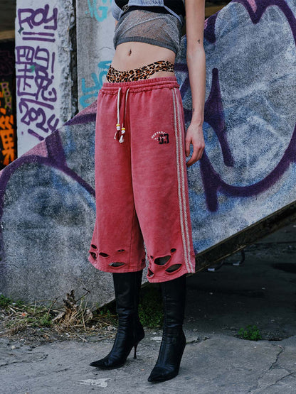 Zerrissene rote Culotte-Jeans im Used-Look