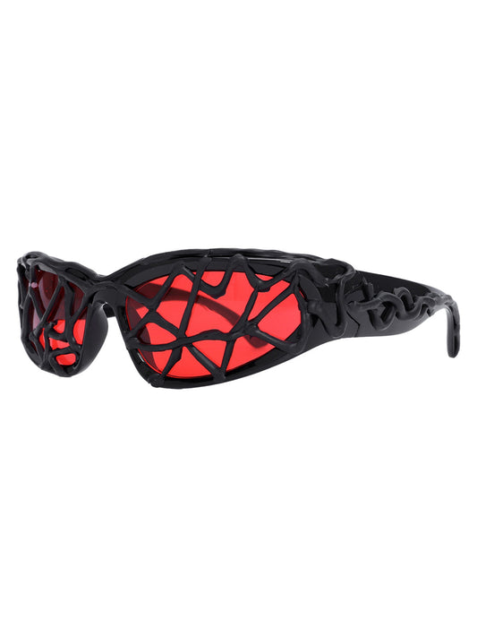 Lunettes de soleil futuristes à monture ondulée