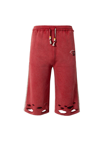 Zerrissene rote Culotte-Jeans im Used-Look