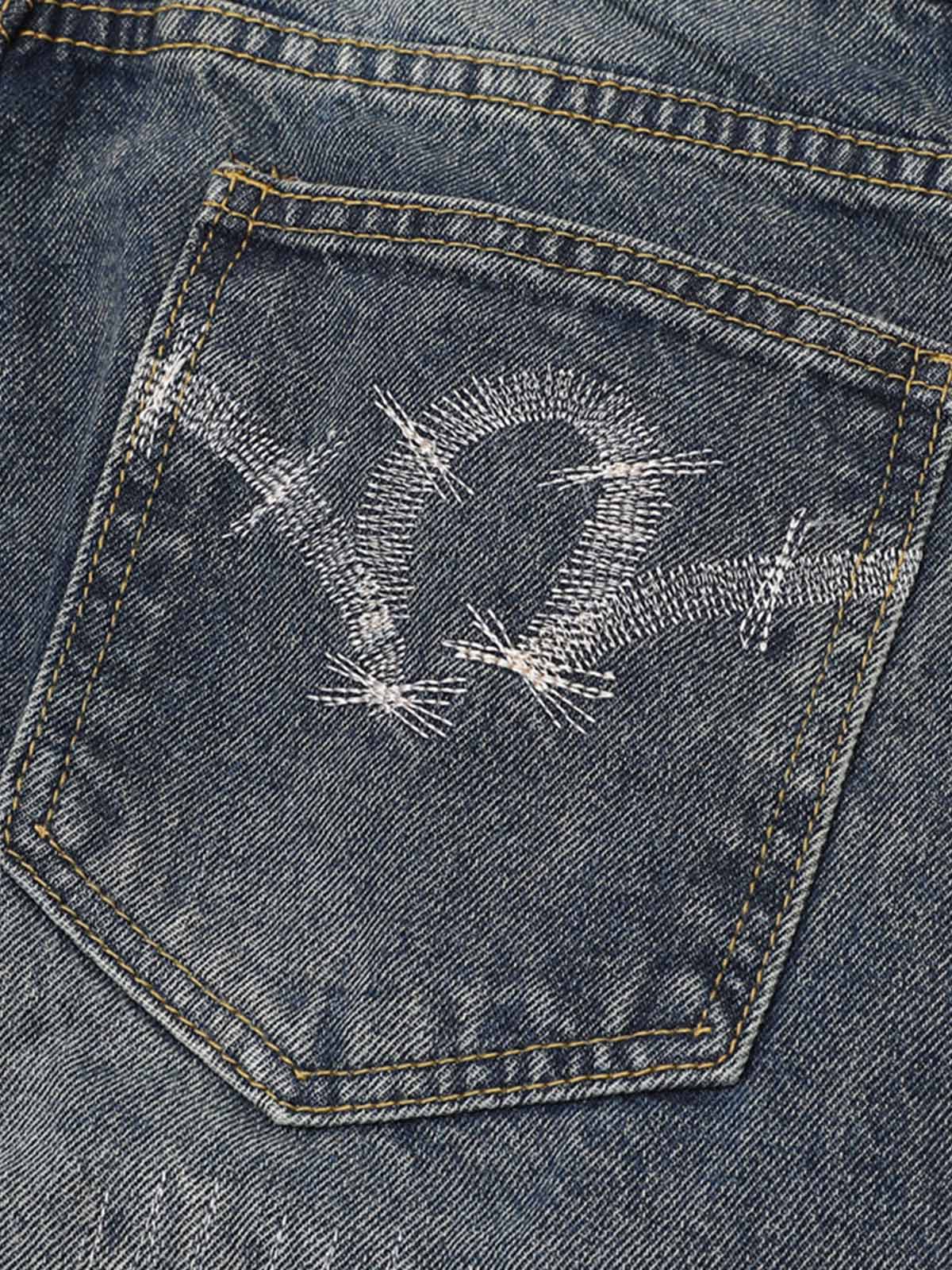 Distressed Camouflage Patchwork Jeans