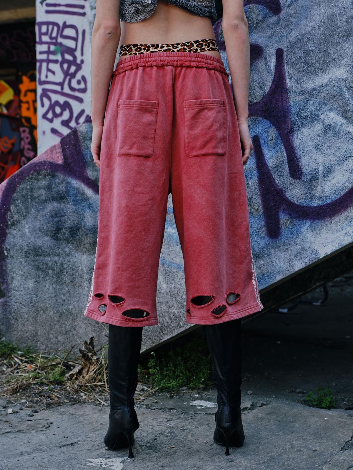 Zerrissene rote Culotte-Jeans im Used-Look