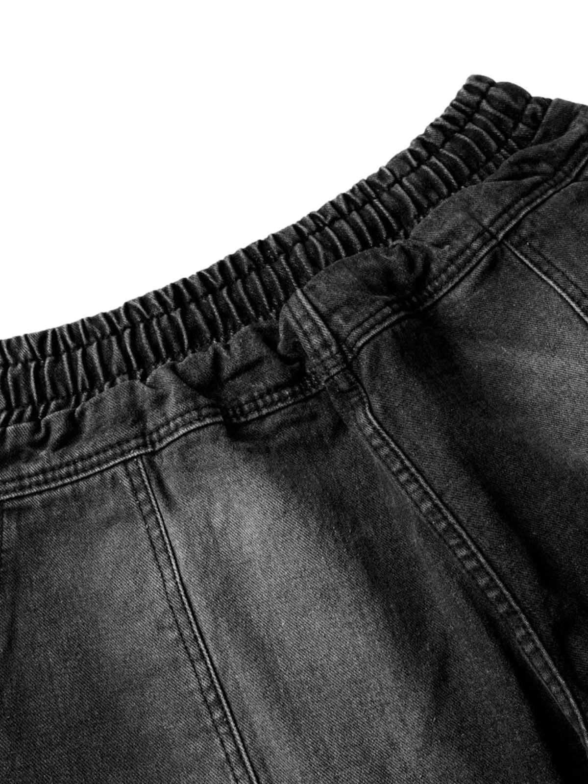 Verwaschene Distressed-Jeans im dekonstruierten Split-Cordstring-Stil